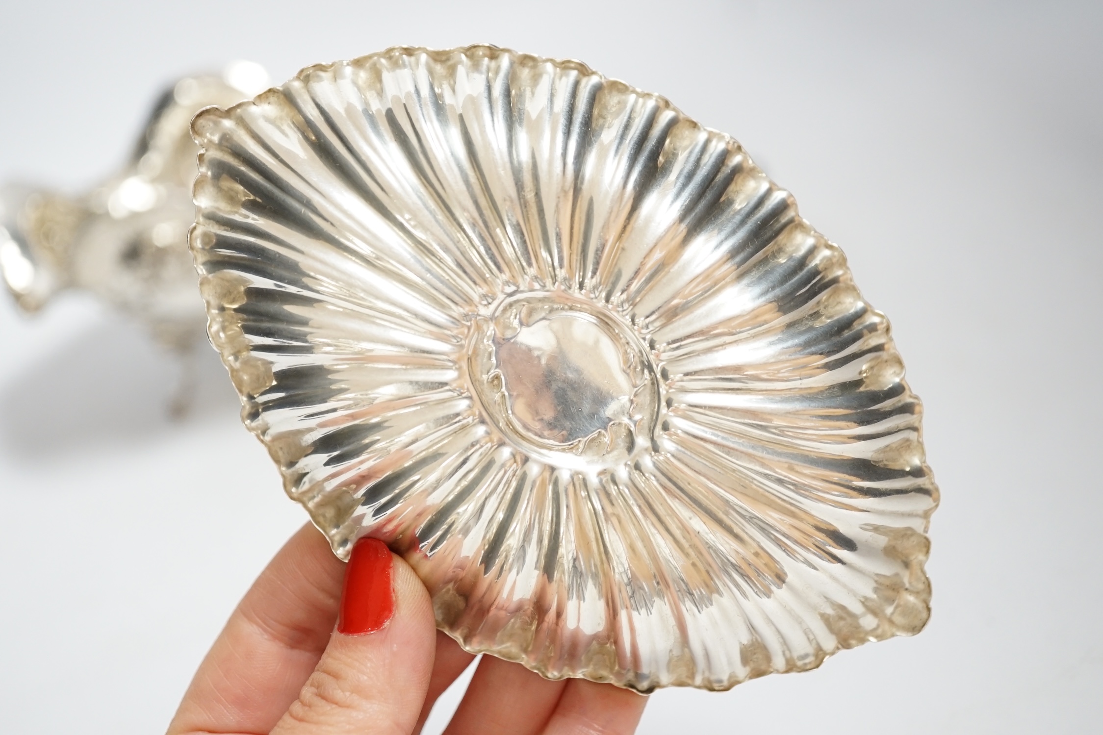 A late Victorian repousse silver heart shaped dish, I.S. Greenburg & Co, Birmingham, 1894, 14.3cm, a small silver dish and Hanau white metal bowl, 12.1oz.